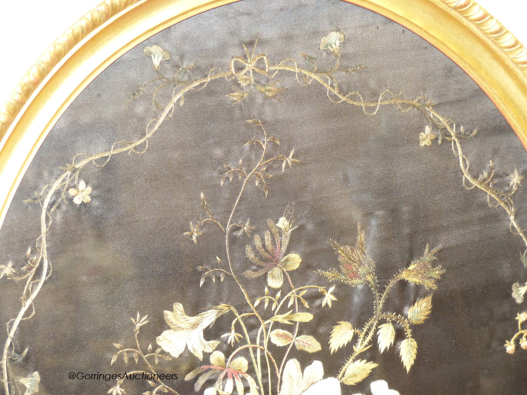 A 19th century silk embroidery of flowers on black silk background, 51 x 45cm